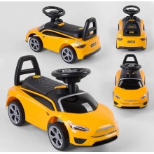 Дитяча каталка JOY TS 50909 Толокар Tesla музичне кермо Багажник Жовтий