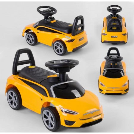 Дитяча каталка JOY TS 50909 Толокар Tesla музичне кермо Багажник Жовтий